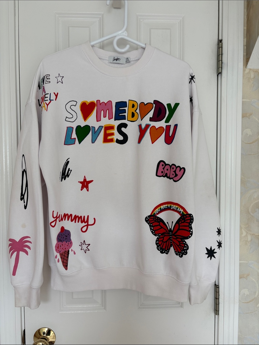The Mayfair Group White Graphic Crewneck Sweatshirt - Somebody Loves You Design